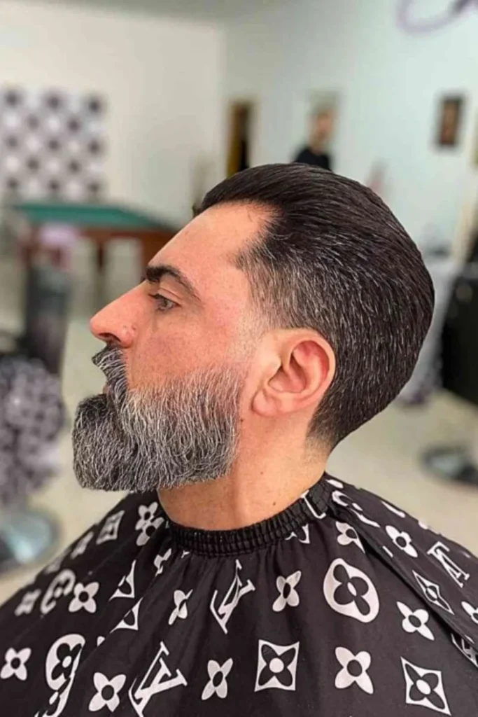 Combed Back with Low Fade and Beard