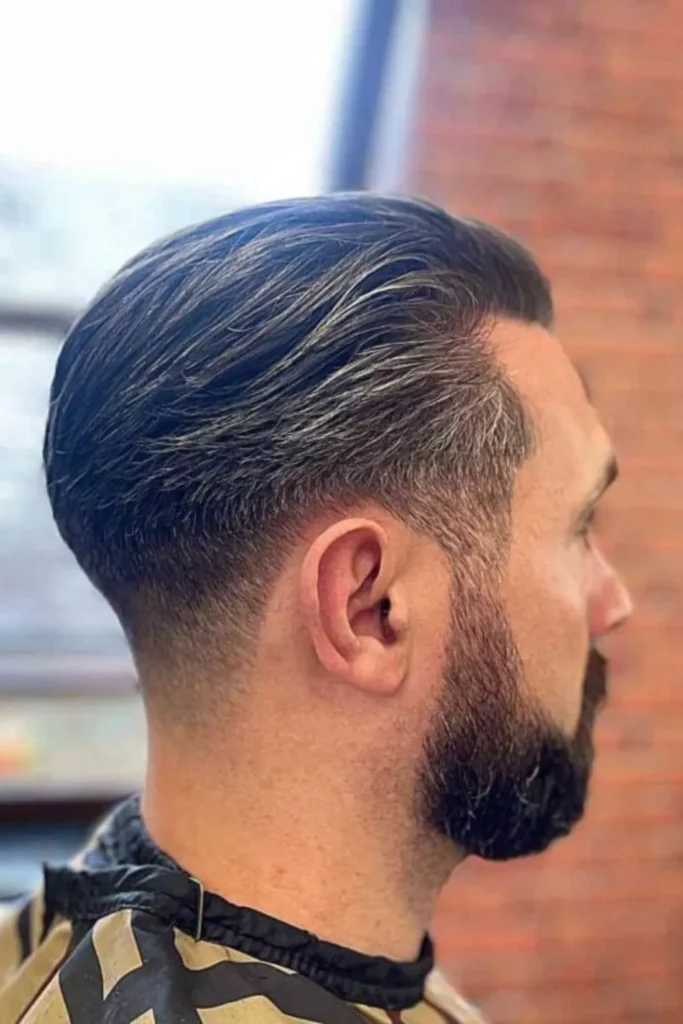 Sleek and Straight Fade Hairstyle with Full Beard