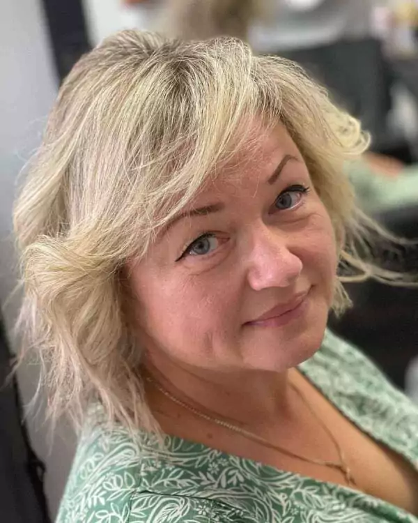 Blonde Feathered Bob with Side-Swept Bangs
