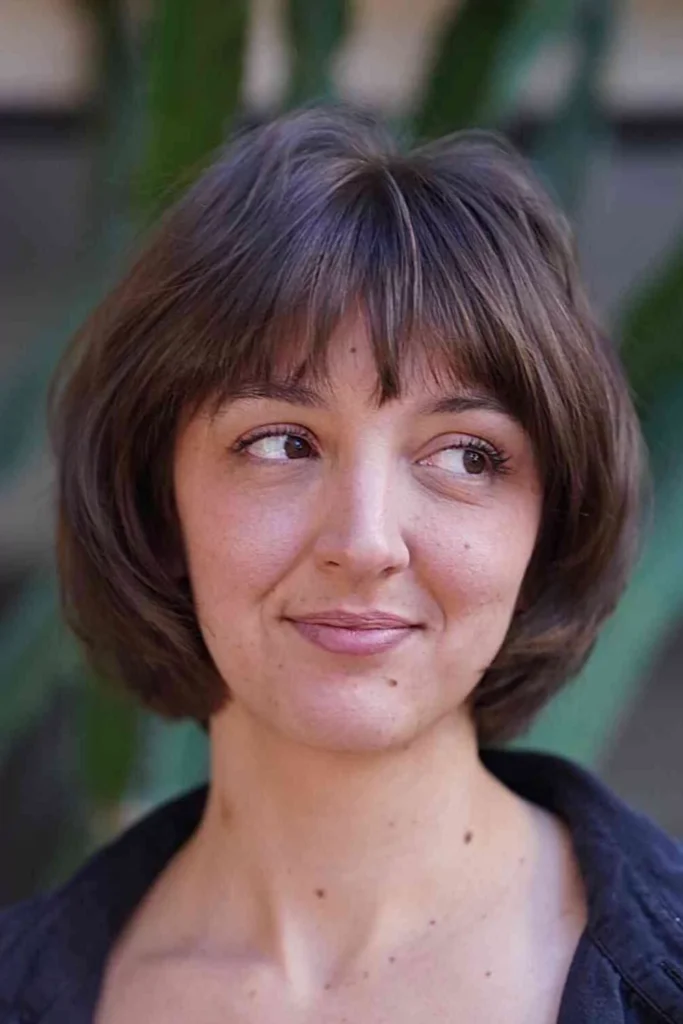 Soft Bangs and Layers for a Round Bob Cut