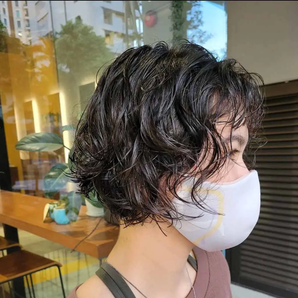 Curly Wolf Cut Bob With Curly Wispy Bangs