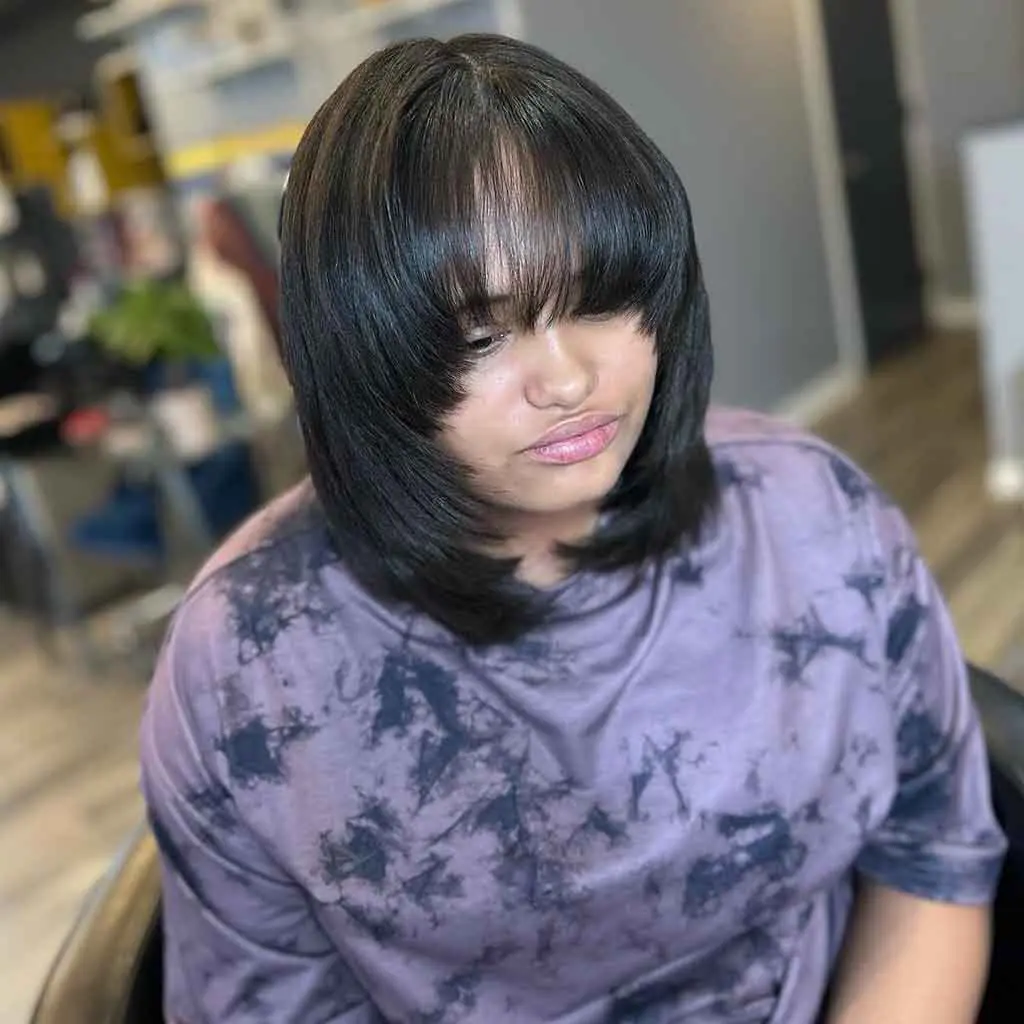  Face-Framing Bob Wolf Cut With Long Choppy Bangs on Shiny Black Hair