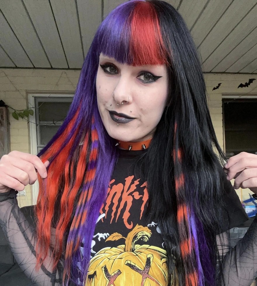 Vibrant Long Layered Hairstyle with Bold Purple, Red, and Black Highlights