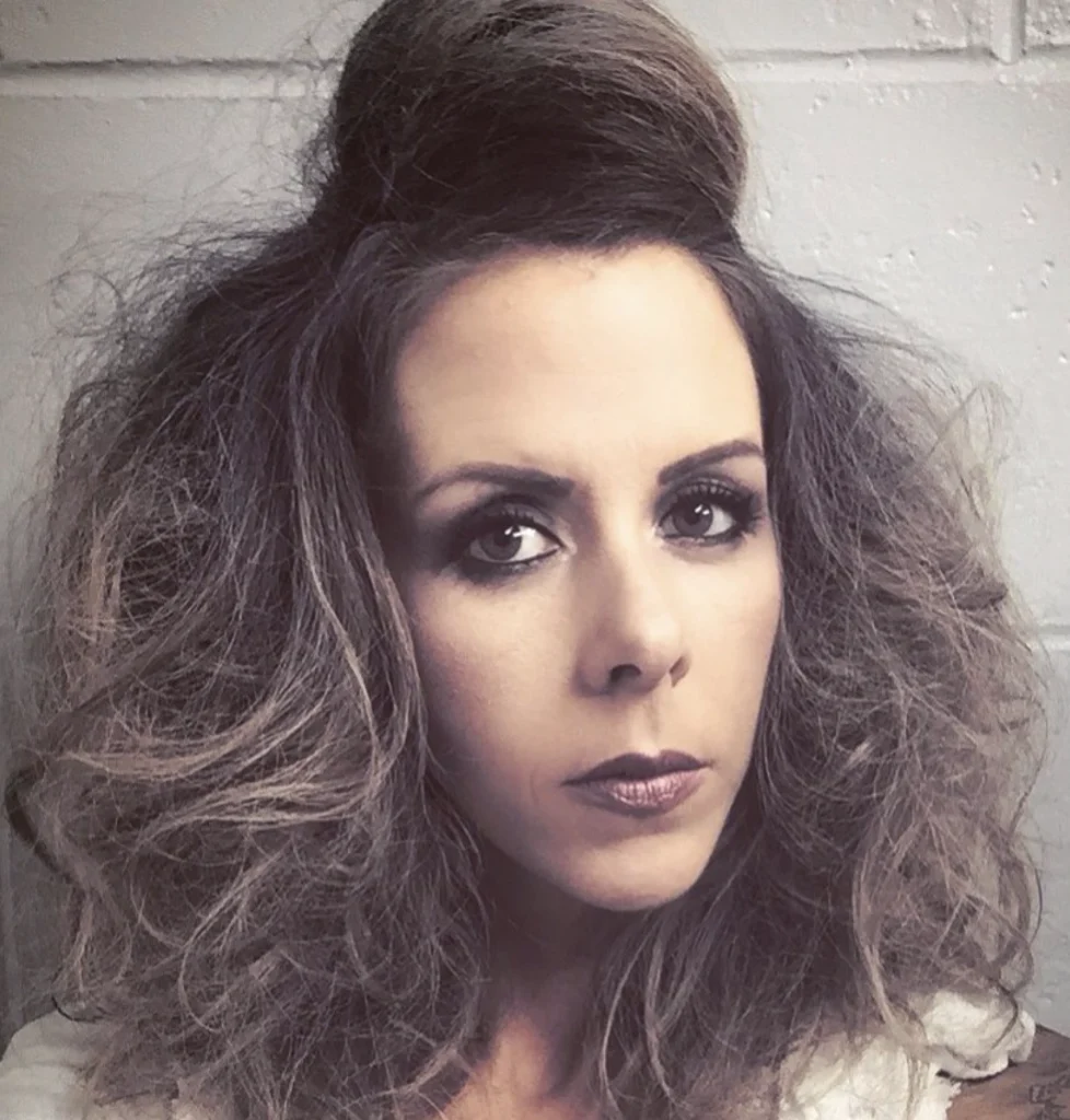 Voluminous Half-Up Hairstyle with Textured Waves